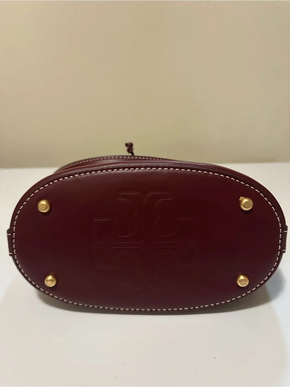Tory Burch Leather Drawstring Bucket Bag with Gold Hardware in Huckleberry Color